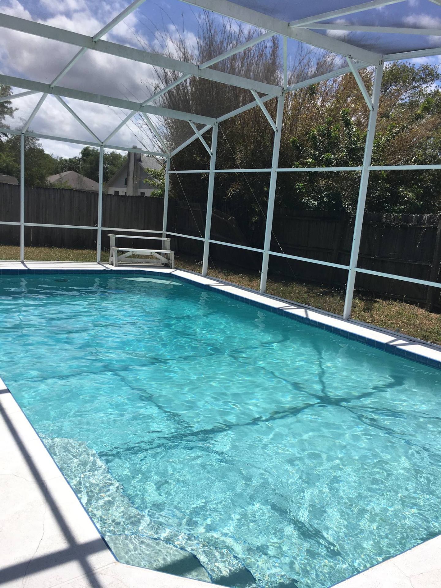 Local pool service near me — Sunny Clean Pool truck on a residential route in Wedgefield 32833